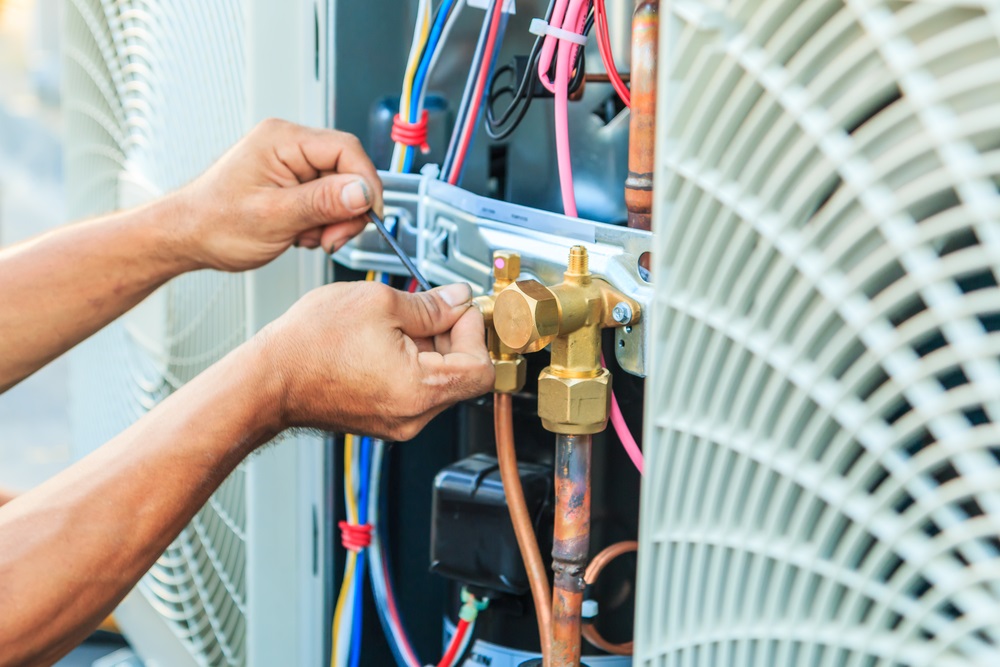 Air,Conditioning,Technician,And,A,Part,Of,Preparing,To,Install